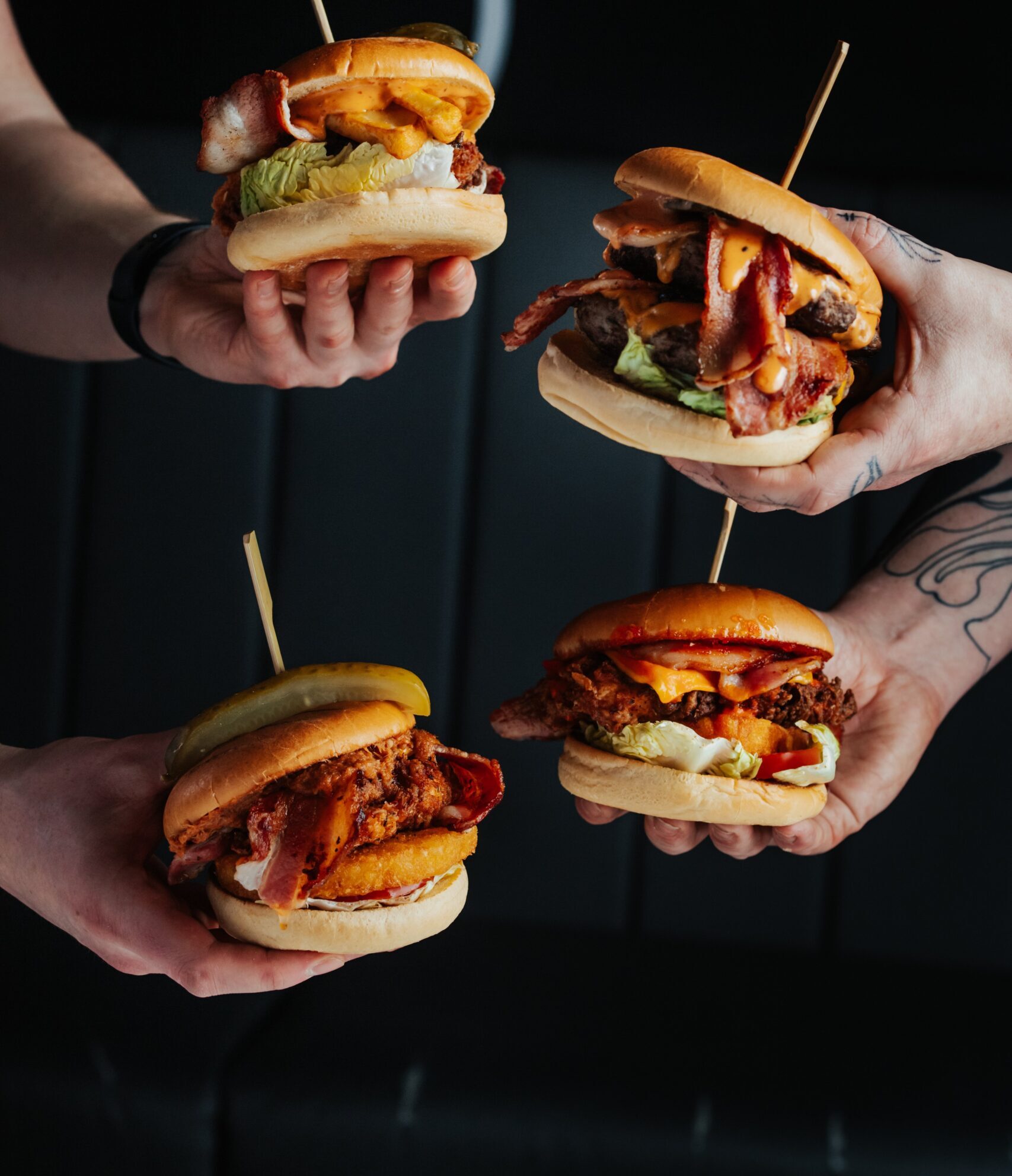 The Common Room burger in hands showing fillings
