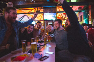 NFL Super Bowl broadcast shown on big screens inside the Common Room sports bar.